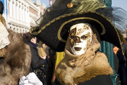 Traditionally dressed Venice carnival  female performer in Piazza San Marco, Italy