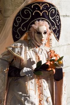 Traditionally dressed Venice carnival  female performer in Piazza San Marco, Italy