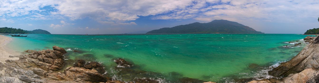 High resolution panoramic image of the tropical sea, with shoreline and island