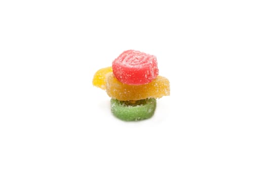 Colour fruit jellies in sugar on white background