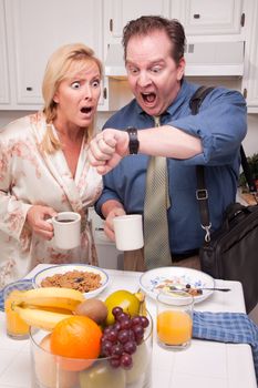 Late for Work Stressed Couple Checking Time in Kitchen.