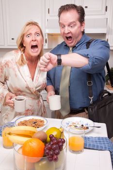 Late for Work Stressed Couple Checking Time in Kitchen.