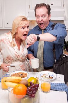 Late for Work Stressed Couple Checking Time in Kitchen.