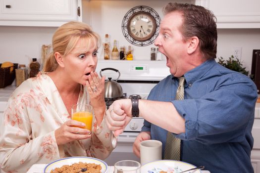 Late for Work Stressed Couple Checking Time in Kitchen.