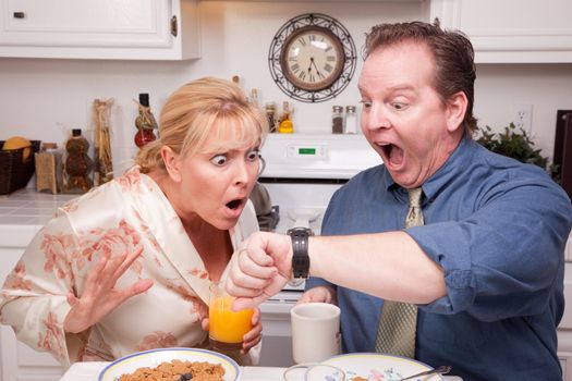 Late for Work Stressed Couple Checking Time in Kitchen.