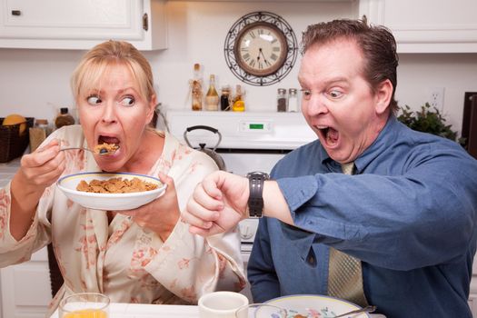 Late for Work Stressed Couple Checking Time in Kitchen.