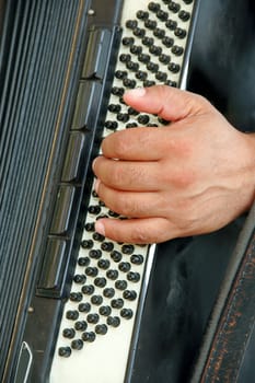 Man playing his harmonica