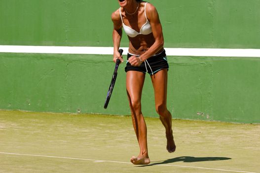 Woman running for the ball. Note that the picture is in motion blure (most the hand).