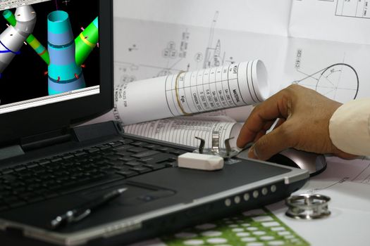 Mechanical engineer doing his design work in a computer.note: display on the monitor is my 3d original works.