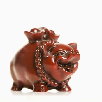 Chinese pig figurine on white background.
