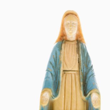 Virgin Mary statue with hands held out against white background.