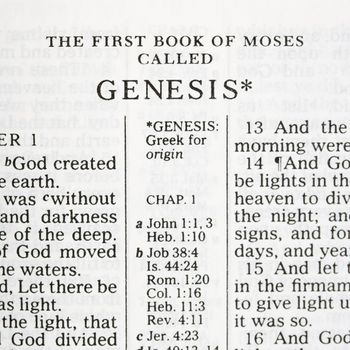 Close up of verses of Genesis in Holy Bible.