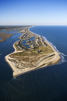 Aerial view of peninsula with beach and buildings in Murrells Inlet, South Carolina.