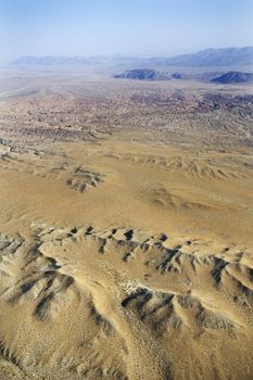 Aerial view of mountainous desert landscape.