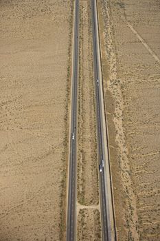 Aerial view of interstate through desert landscape.