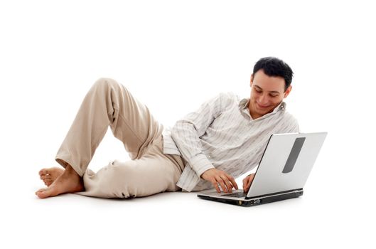 relaxed man with laptop computer over white