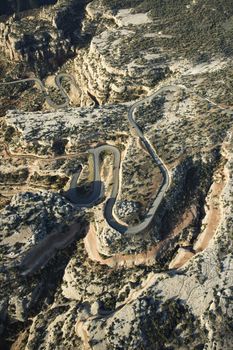 Aerial of curvy road in high desert landscape of Utah, USA.