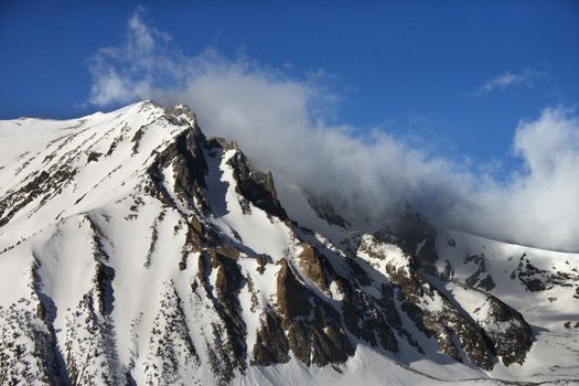 Aerial of snow covered mountain landscape in California, USA.