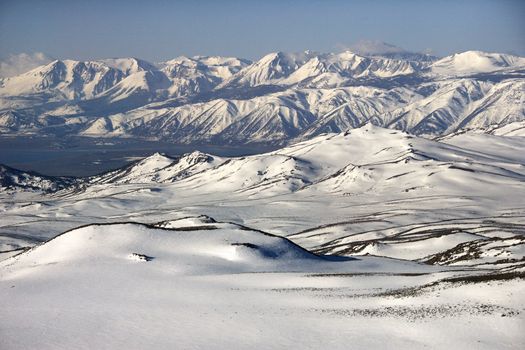 Aerial of snow covered mountain range in California, USA.