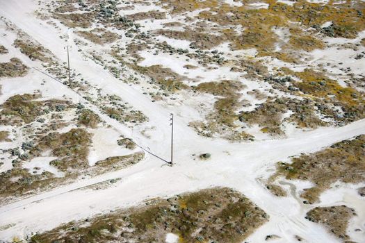 Aerial of dirt road crossroads in rural landscape, California, USA.