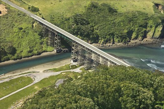 Aerial of Shoreline Highway bridge over water in California, USA.