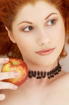 picture of lovely redhead with delicious apple