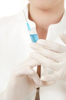 hands in rubber gloves with syringe over white