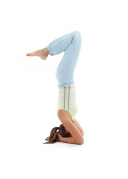 sporty girl practicing salamba sirsasana supported headstand