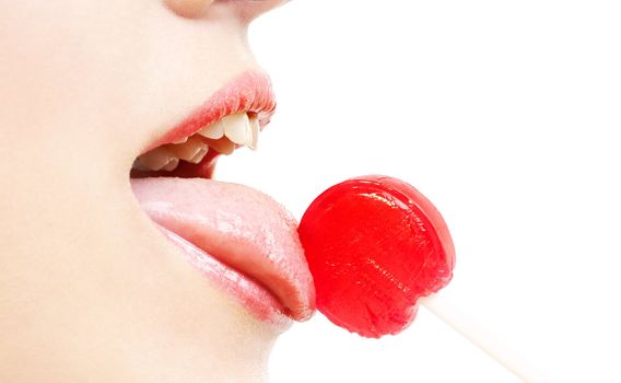 picture of lips, tongue and candy over white