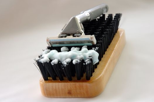 Time for hard shave. Brush like symbol of wiry (coarse) bristle.