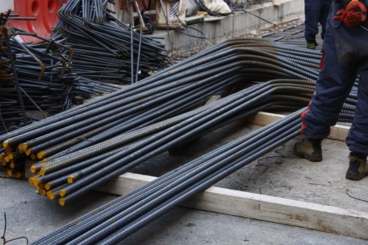 construction steel rods with worker in a construction site
