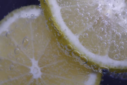 close up of a Lemon slice with bubbles