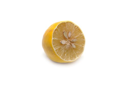 Half of the lemon, cut dry on white background