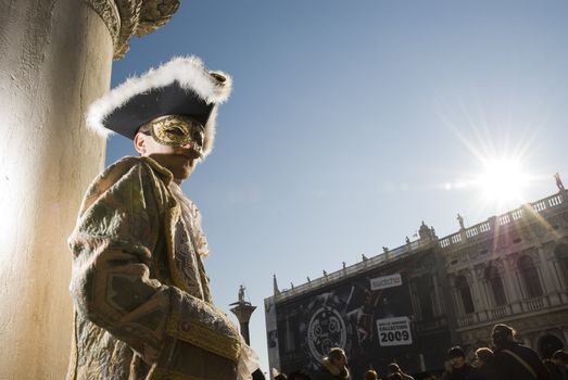 Traditionally dressed Venice carnival  male performer in Piazza San Marco, Italy