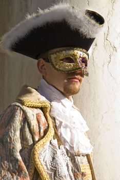 Traditionally dressed Venice carnival  male performer in Piazza San Marco, Italy