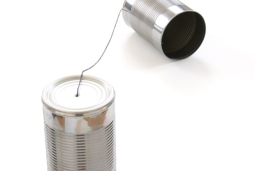 A homemade toy telephone out of tin cans and a string.