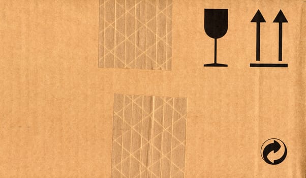 Corrugated cardboard with fragile glass and wet umbrella symbols