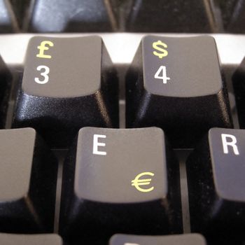 Dollar Euro Pound symbols on computer keyboard keys