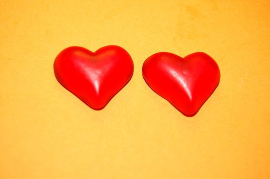 the two hearts  on yellow background