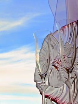 wedding champagne glasses against the blue sky