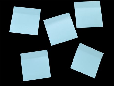 five blue note pads on the black board