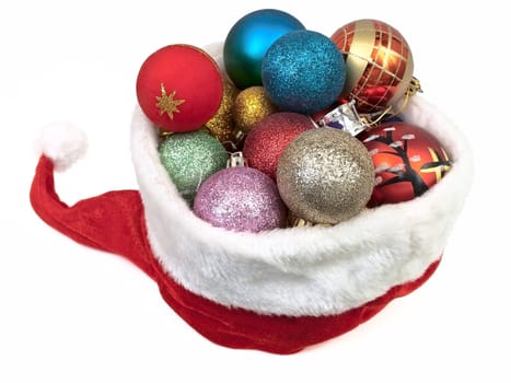 red christmas hat with new-year yoys over white background