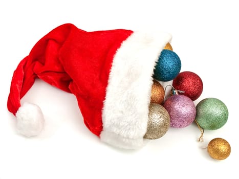 red christmas hat with new-year yoys over white background
