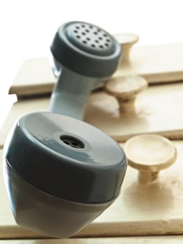 Old telephone handset hang over the drawers