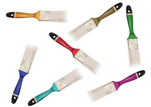 cattered multicolored brushes against the white background