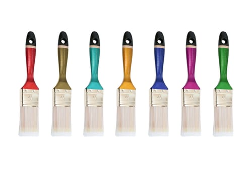 Row multicolored bristles against the white background