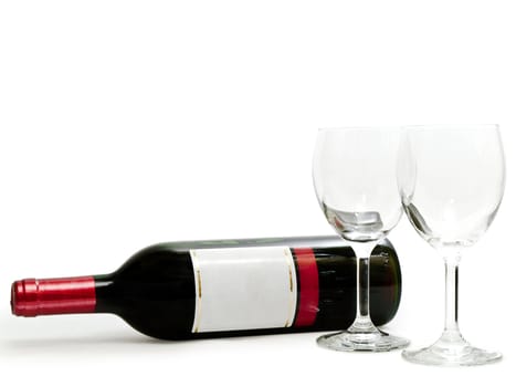  bottle of the red wine with wineglasses against the white background