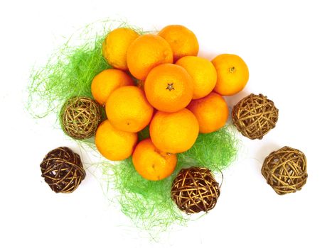new year orange mandarin decoration with golden ball in green