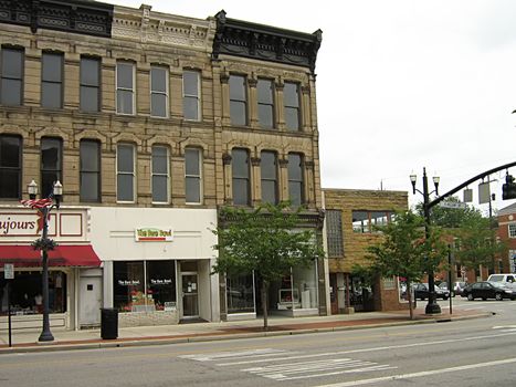 A photograph of commercial buildings in a town.
