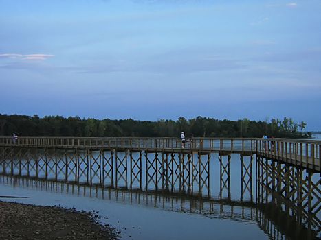 A photograph of a pier near a waterway.